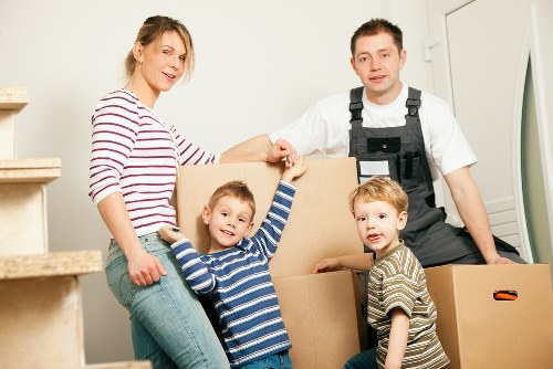 Local van removals team handling furniture in Hornchurch