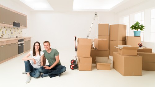 Furniture and boxes being unloaded at a new Hornchurch home