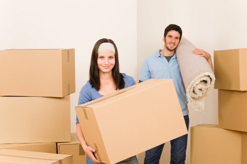 Local office relocation team handling furniture in Hornchurch