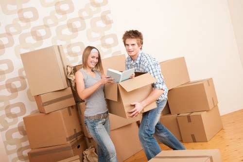 Professional movers carrying furniture in Hornchurch