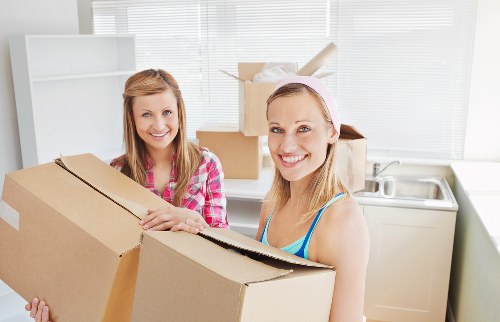 Family preparing boxes for a home move in Hornchurch